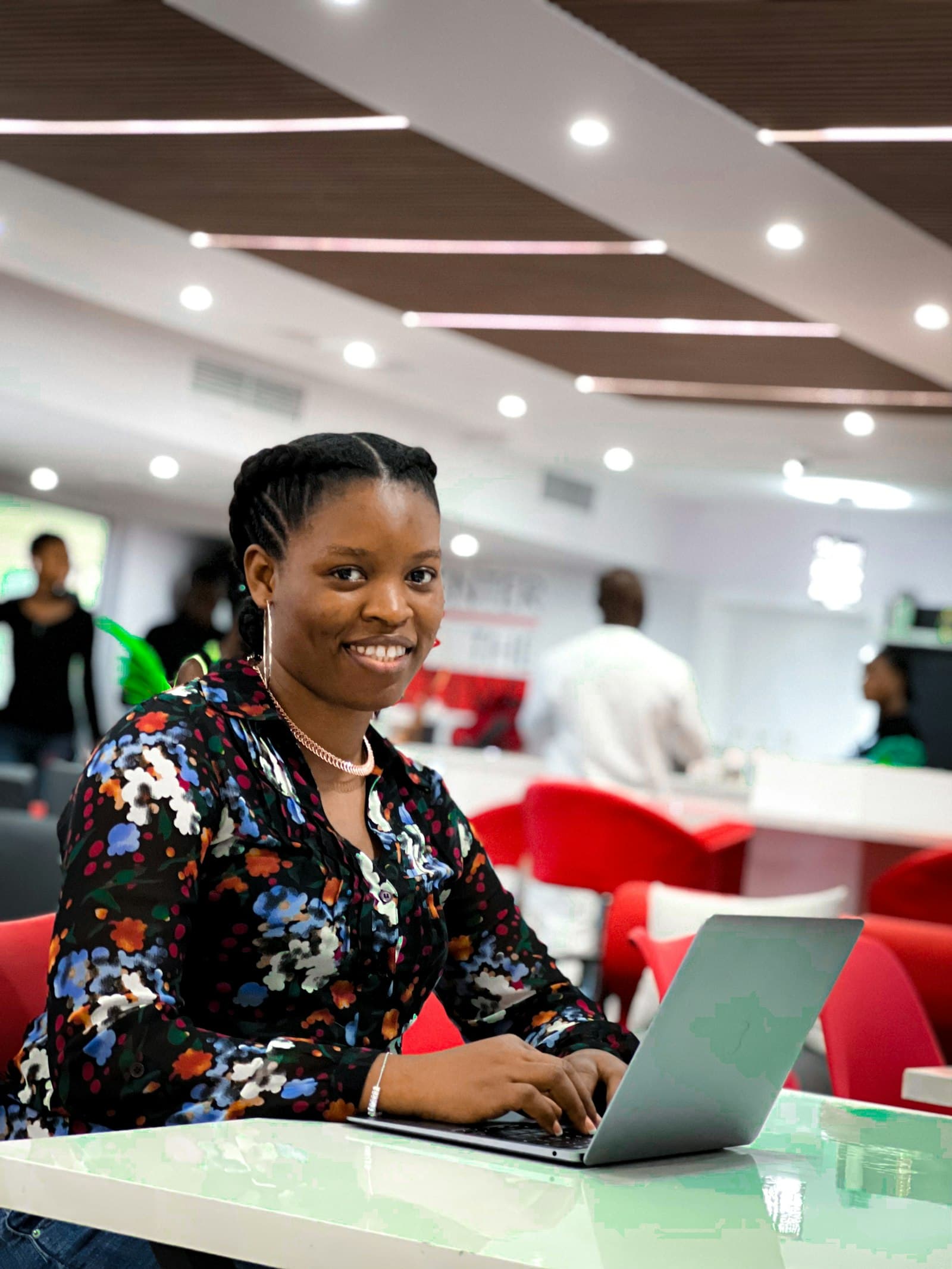 Developer smiling at her laptop