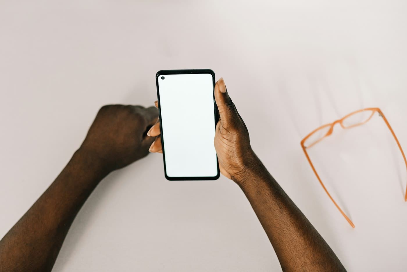 Hands holding a smartphone